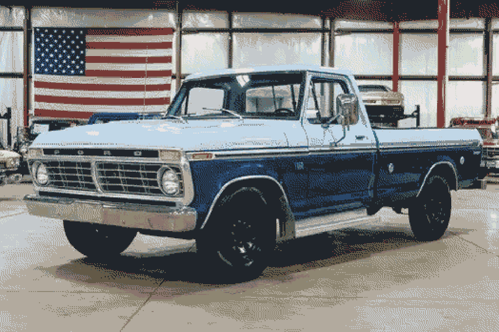 An image of a 1975 Ford F-250 that is two-toned dark and powder blue.