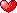 An animated heart with a blinking star in pixel art style.